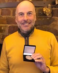 Rick Stanton presented with Explorers Club 'Chapter Coin'