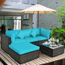 This ottoman table would work in a casual cabin or an elegant mountain mansion. Gymax Gym06228 5pcs Rattan Patio Conversation Set Outdoor Furniture Set W Ottoman Turquoise Cushion