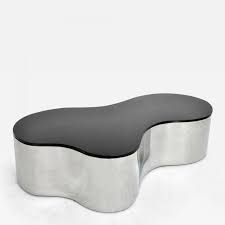 If ottoman largely retained its form, then the coffee table has evolved with time. Karl Springer Large Free Form Coffee Table By Karl Springer