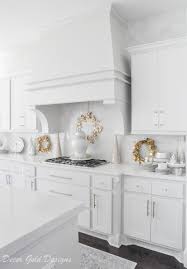 This white shaker kitchen feels open, airy, and maintains a sense of visual consistency throughout. Bright White Christmas Kitchen Decor Gold Designs