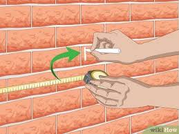 Bright, bold colorful artwork and furniture pieces make a brick wall stand out that much more. 4 Ways To Decorate Brick Walls Wikihow