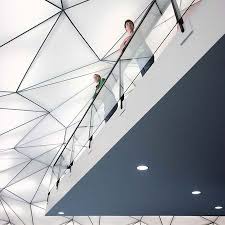 Approximately 390 Translucent Triangular Back Lit Panels Are Suspended From The Ceiling S Steel Structure Atrium Design Light Architecture Architecture