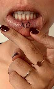 Pictures of cute matching tattoos for couples. Xo Inner Lip Tattoo Inner Lip Tattoo Lip Tattoos Lip Tatto