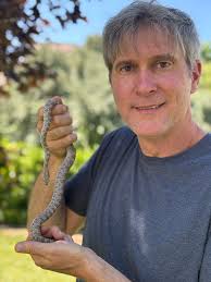 coworkers getting shirts with snake picture