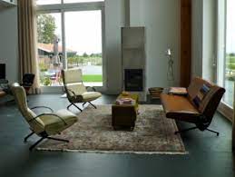 Centre modern furniture around a cubic rug. Interiors My Modern