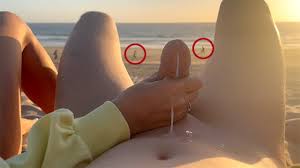 Public handjob. Hand job on a nude beach. We were caught jerking off at  sunset near the ocean