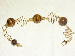 The meaning of this stones name relates to its resemblance to the eye of a tiger or cats eye. Tiger Eye Information Tigers Eye Gem Profile Jewelry Making Blog Information Education Videos