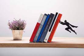 bookend shaped as a superhero metal designed bookends etsy book accessories cool gifts ikea bathroom cabinet