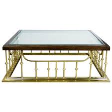 I think he had seen something like that before or heard of someone making one. Brass Glass Wood Fireplace Fender Style Erwin Lambeth Large Square Coffee Table At 1stdibs