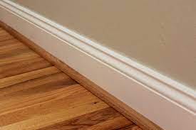 Transitions between a wood floor and a vertical surface under cabinetry. Oak Quarter Round To Finish Off The Baseboard And Flooring Project Baseboards White Baseboards Floor Molding