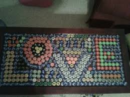 An interesting way to display your collection of really anything flat is to encase it inside a table using for example, if you have a bottle cap collection, you could create a lively surface or table using your i glued all the beer caps to the table, then poured the resin on it. Bottle Cap Coffee Table Made It Myself Beer Cap Art Bottle Cap Crafts Beer Cap Table