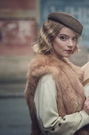 A gangster family epic set in 1919 birmingham, england and centered on a gang who sew razor blades in the peaks of their caps, and their fierce boss tommy shelby, who means to move up in the world. Dressed Wonderfully Anya Taylor Joy As Gina Gray In Peaky Blinders