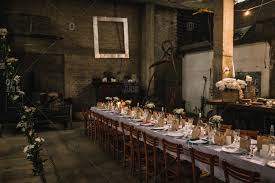 Soup is served in a heated soup dish, atop a dinner plate, and eaten with the soup spoon, which is placed at the outer right. Loft Space Set Up For A Large Dinner Party Stock Photo Offset