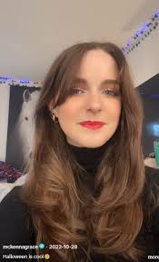 Taller girl with dark curly hair at 7brew today