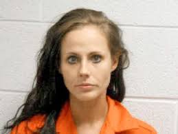 Woman faces charges after pointing guns