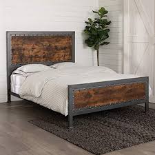 A wicker chair topped with a soft striped pillow tempers the bold black bedding. Walker Edison Rustic Farmhouse Queen Metal Headboard Footboard Bed Frame Bedroom Reclaimed Brown Wood