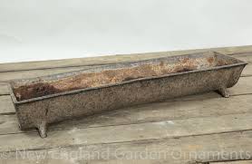 A new item to feed all your farm animals around it, does not tame wild animals. Antique Cast Iron Feeding Trough New England Garden Company