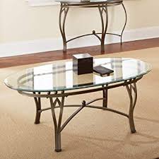 A glass top coffee table is the luxe version of designer coffee tables. Amazon Com Steve Silver Madrid Oval Glass Top Coffee Table Furniture Decor