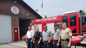 Two firefighters rescue family stranded