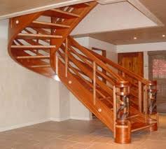 Modern industrial loft stairs against exposed brick wall. 16 Wooden Staircase Ideas To Spice Up Your Interior Design