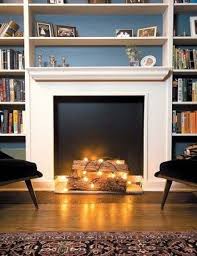 Picture light and abstract painting above fireplace in. 25 Cozy String Lights Ideas For Living Rooms Digsdigs