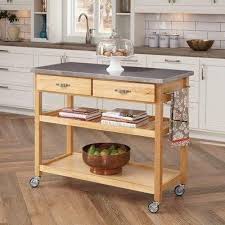 This versatile cart is made of rubber wood and a sturdy steel frame featuring four caster wheels that easily rolls to wherever you need it. Large Kitchen Island Cart Wheels Rolling Roller Workstation Butcher Block Basic Appliance U Kitchen Dining Furniture Rolling Kitchen Island Kitchen Island Cart