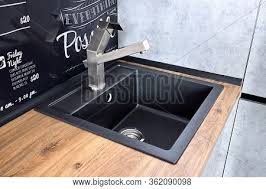 Modern kitchen cabinet with black table top. Modern Design Chrome Image Photo Free Trial Bigstock