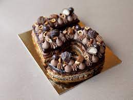 Ici voici le rétro planning possible versez la crème en 3 fois sur le chocolat fondu : Chez Bogato Gateaux Festifs Number Cake Chocolat