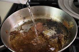 With only the burnt residue left in the pans, place the emptied pans on the cool stovetop and fill each with a cup each of water and white vinegar. So Shiny So Clean 7 Ways To Clean A Scorched Pan Hgtv