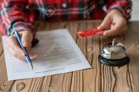 Preparation for a handover (f. Woman Filling Hotel Reservation Form Check Mark Choosing Credit Stock Photo Picture And Royalty Free Image Image 147892013