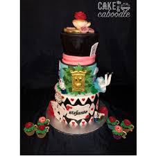 A little history of alice in wonderland. Alice In Wonderland Cake And Mini Teacup Cupcakes Cake And Caboodle