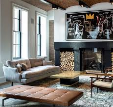 Eclectic And Masculine Den With Black Stone Fire Place Suede Danish Sofa And Caramel Leather Daybed Design Interior House Design
