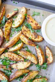 Roasted Potato Wedges With Mustard Tahini Dipping Sauce This Savory Vegan Recipe Roasted Potato Wedges Food Savory Vegan