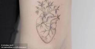 One simple rose is all you need sometimes. Flower Heart Tattoo On The Back Of The Right Arm