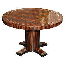 Many people notice a coffee table purely like a decorative item, building a style statement and giving a sense of coherence with a room; Round Art Deco Macassar Ebony Table With Bone Inlay For Sale At 1stdibs