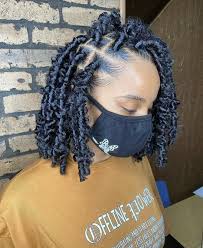 Shoulder length hair, displaying the bright orange rosy lips, green eyes and soft, wavy hairstyle that is worn in a casual side parted manner create a small kid hairstyle. Butterfly Locs How To Price And 25 Butterfly Locs Hairstyles