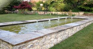 The brick pond with a long glass window is surrounded by lots of. Pond Water Features A D Landscapes Ltd
