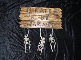 Pirates Of The Caribbean The Curse Of The Black Pearl Skeletons Pirates Ye Be Warned Sign Pirates Of The Caribbean The Curse Of The Black Pearl Takes Hat Off And Pirate Signs Pirates Of The Caribbean Pirates