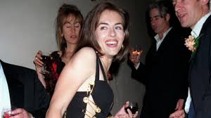 Angelina jolie's black velvet 'leg' dress at the 2012 oscars 5. Liz Hurley S Safety Pin Dress Made Fashion History Cnn Style