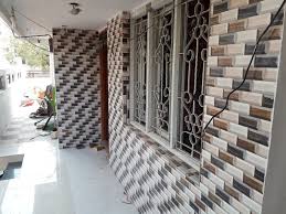 Grey might be the new black of interior designing, i.e., the latest trendy colour in tiles. Front House Wall Tiles Design Pictures