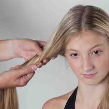 From a center parting, brush your hair smooth to the head. How To Make Heidi Braids Step 1 Of 9