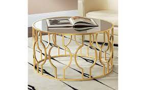 Price match guarantee enjoy free shipping and best selection of oval metal and glass coffee table that matches your unique tastes and budget. Amazon Com Fara 35 1 2 Wide Gold Leaf Round Coffee Table 55 Downing Street Home Kitchen