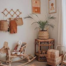 amazing kids room full of rattan furniture and wicker toys and accessories featuring olli ella luggy wheeled b boho kids room baby room decor baby room design