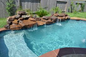 This Small Pool And Spa In Katy Tx Houston Tx Features Stamped Overlay Concrete Deck In An Ashl Backyard Pool Landscaping Small Backyard Pools Backyard Pool