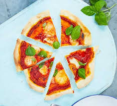 Pizza sauce with fresh herbs and vegetables. Pizza With Homemade Sauce Recipe Bbc Good Food
