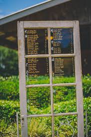 rustic window pane glass door wedding seating chart marry