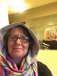 My momma found Go For Faux yarn and wanted "something" ..so I made a hooded  infinity scarf for her. I had leftover yarn and I asked her what she wanted  me to