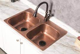 Some delta faucet products may look identical but have a different price and model number because they actually have different features or may be constructed differently on the inside. Sinkology Riley Copper Kitchen Sink With Delta Arabella Pull Down Kitchen Faucet In Bronze At Menards