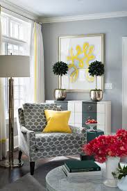 It is a set of 2 chairs with a comfortable stuffing. Gray Corner Reading Chair With Canary Yellow Pillow Contemporary Living Room