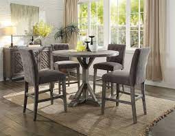 Built from solid rubberwood, this handsome table nestles nicely against a wall, the ideal dining piece for condos and other smaller abodes. Carmelina 5 Piece Round Table Counter Height Dining Set In Weathered Gray Oak Finish By Acme 71865